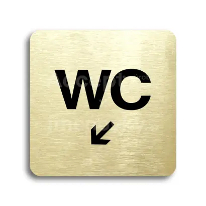 Piktogram "WC vlevo dolů" - zlatá tabulka - černý tisk bez rámečku
